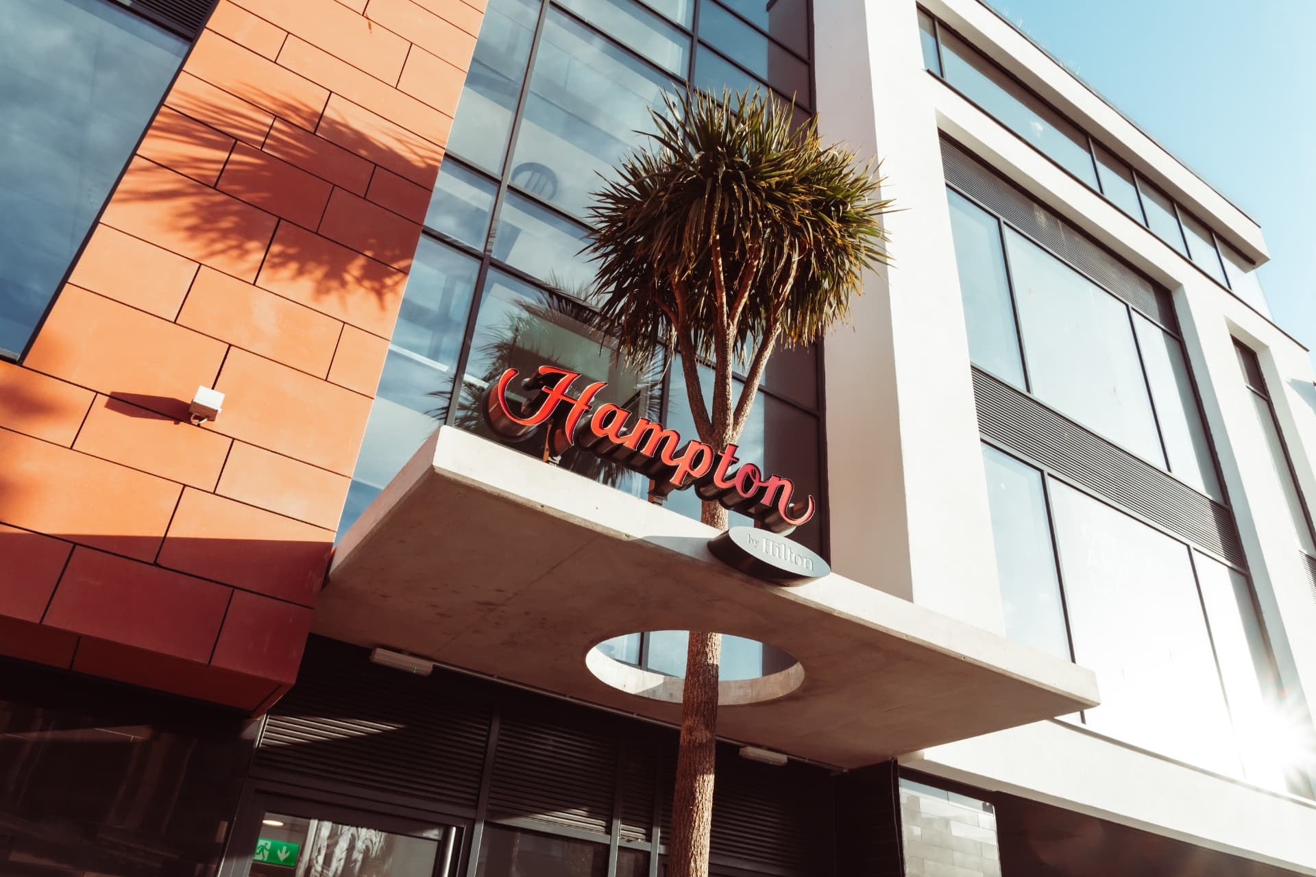 Hampton by Hilton signage above the hotel entrance canopy in Torquay
